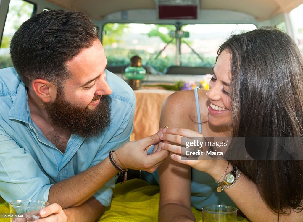 Man making a proposal of arriage in a van