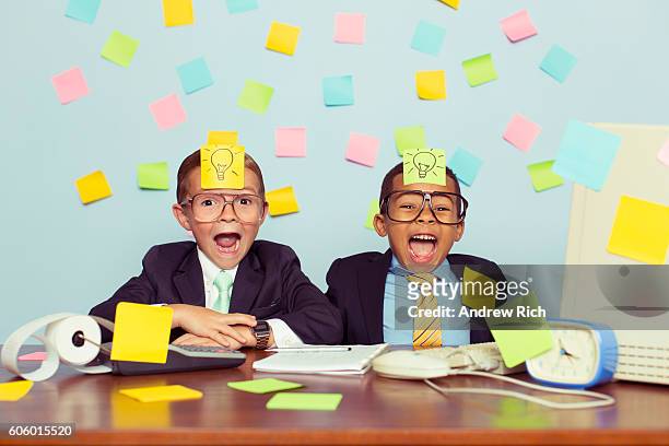 two young businessmen covered with light bulb sticky notes - vintage funny black and white stock pictures, royalty-free photos & images