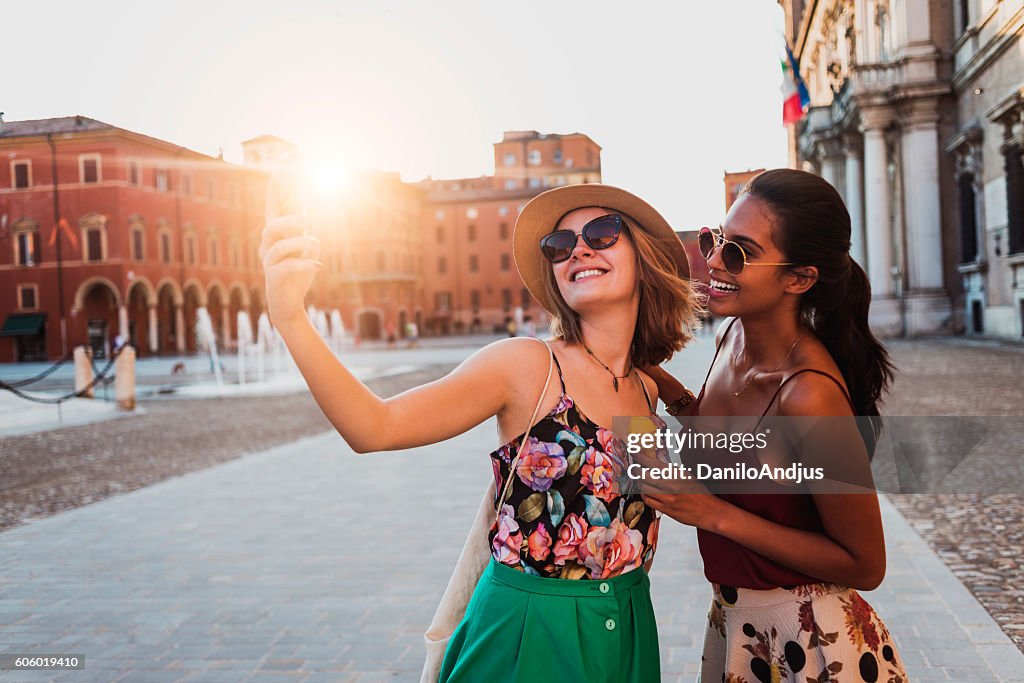 Beautiful two young women taking a selfie