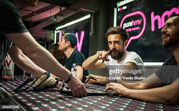 Chris Wood, Dan Smith and Kyle Simmons of Bastille meet fans and perform songs from their new album 'Wild World' at HMV Oxford Street on September...