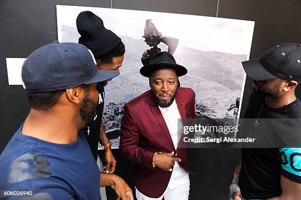 Earl Little, Udonis Haslem, Bob Metelus and Dwyane Wade attend Haitian photographer Bob Metelus unveils newest collection, Haiti: A Collective Cry...