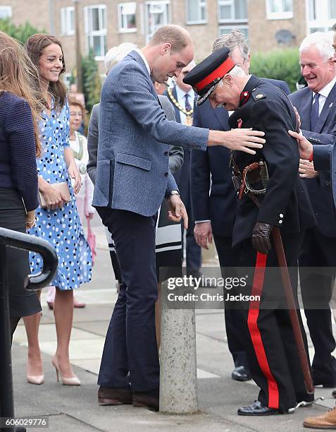 Catherine, Duchess of Cambridge looks on as Prince William, Duke of Cambridge rushes to helpVice Lord Lieutenant of Essex Jonathon Douglas-Hughes who...