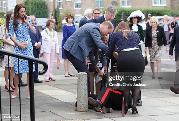 Catherine, Duchess of Cambridge looks on as Prince William, Duke of Cambridge rushes to helpVice Lord Lieutenant of Essex Jonathon Douglas-Hughes who...