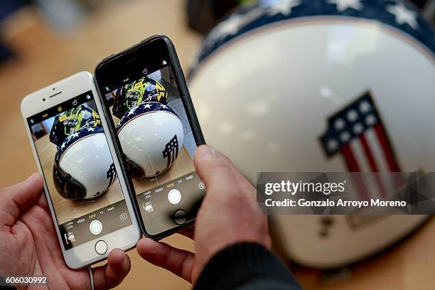 Customer compares pictures taken with an Iphone 6 and the new Iphone 7 at Puerta del Sol Apple Store the day the company launches their Iphone 7 and...