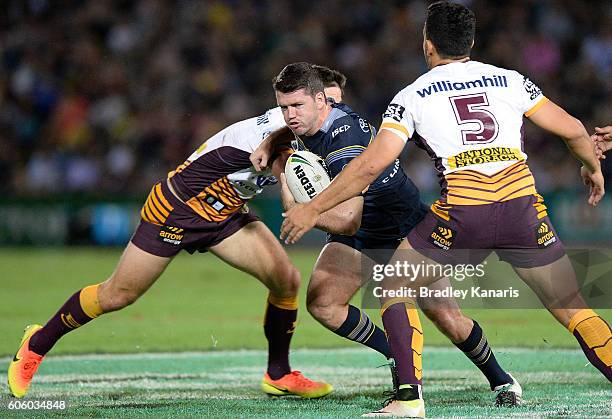 Lachlan Coote of the Cowboys takes on the defence during the first NRL semi final between North Queensland Cowboys and Brisbane Brisbane at...