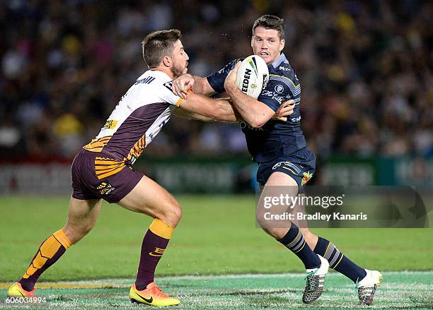 Lachlan Coote of the Cowboys takes on the defence during the first NRL semi final between North Queensland Cowboys and Brisbane Brisbane at...