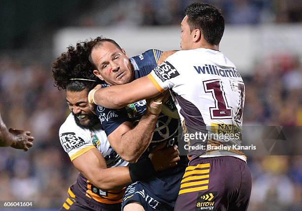 Matthew Scott of the Cowboys takes on the defence during the first NRL semi final between North Queensland Cowboys and Brisbane Brisbane at...