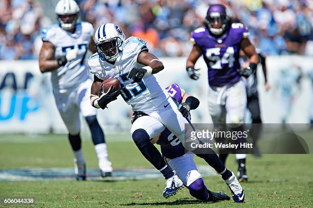 Harry Douglas of the Tennessee Titans runs the ball and is grabbed by Harrison Smith of the Minnesota Vikings at Nissan Stadium on September 11, 2016...