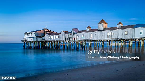 long exposure of the pier at old orchard beach. - orchard beach stock pictures, royalty-free photos & images