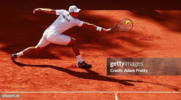 Kamil Majchrzak of Poland hits a backhand during his match against Jan-Lennard Struff of Germany during the 1st rubber of the Davis Cup Playoff...