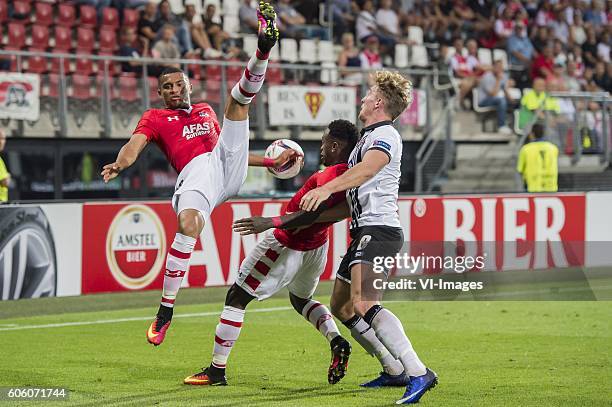 Dabney dos Santos of AZ Alkmaar, Ridgeciano Haps of AZ Alkmaar, John Mountney of Dundalk FC during the UEFA Europa League group D match between AZ...