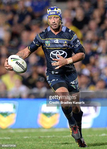 Johnathan Thurston of the Cowboys runs with the ball during the first NRL semi final between North Queensland Cowboys and Brisbane Brisbane at...