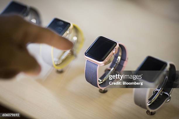 Customer views an Apple Watch Series 2 displayed at an Apple Inc. In New York, U.S., on Friday, Sept. 16, 2016. Shoppers looking to buy Apple Inc.'s...