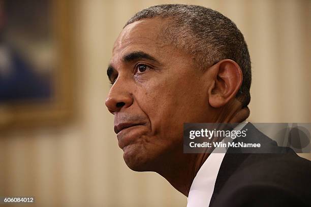 President Barack Obama responds to a question about Republican presidential candidate Donald Trump questioning Obama's place of birth during a...