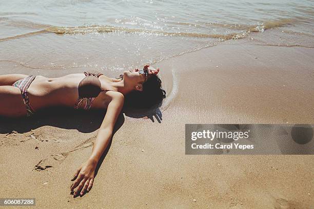 lying on a on a beach,dona ana,lagos - girls sunbathing fotografías e imágenes de stock