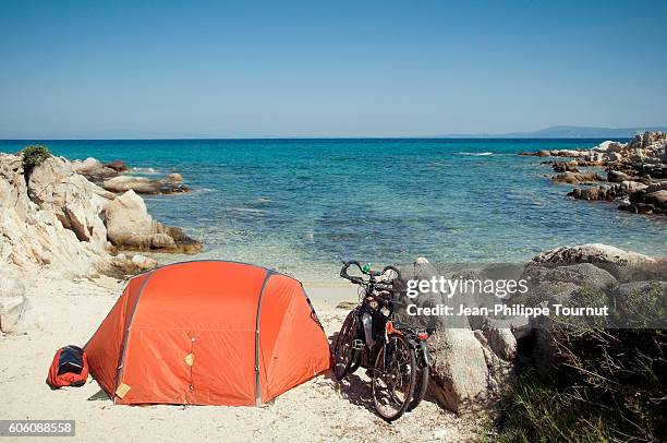 bivouac by the aegean sea in halkidiki , travelling greece by bicycle - greek independence day stock pictures, royalty-free photos & images