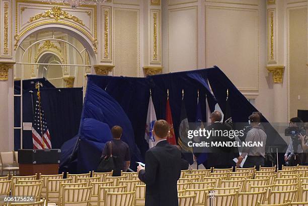 Backdrop collapses while workers were taking it down after a campaign event by Republican presidential nominee Donald Trump at the Trump...