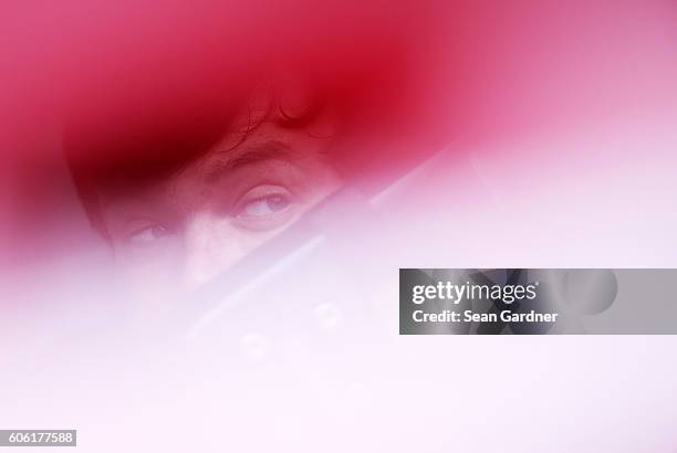 Erik Jones, driver of the Hisense Toyota, sits in his car during practice for the NASCAR XFINITY Series Drive for Safety 300 at Chicagoland Speedway...