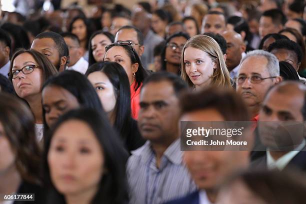 Immigrants take part in a naturalization ceremony on Ellis Island on September 16, 2016 in New York City. The ceremony marked U.S. Constitution and...