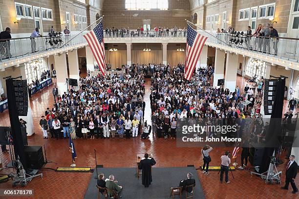 Immigrants take the oath of citizenship to the United States in the Great Hall of Ellis Island on September 16, 2016 in New York City. Robert...