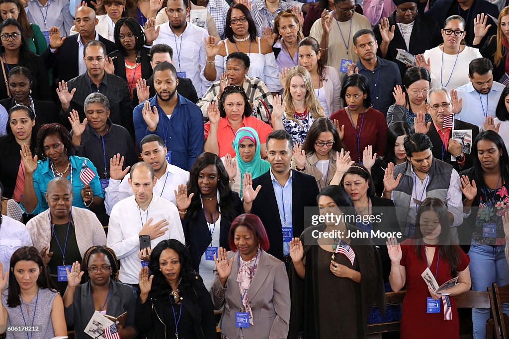 Immigrants To U.S. Become Citizens During Naturalization Ceremony On Ellis Island