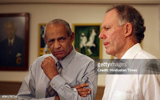 Raj Singh Dungarpur glances rather questioningly at Greg Chappell before the India release of Chappell's book titled Cricket: The Making of champions...
