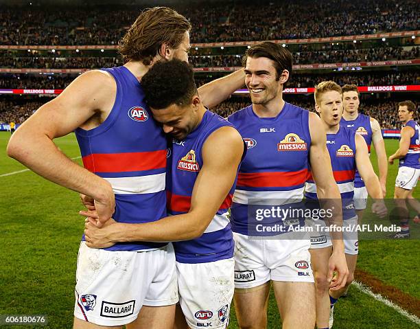 Marcus Bontempelli of the Bulldogs celebrates with Jason Johannisen and Easton Wood of the Bulldogs during the 2016 AFL Second Semi Final match...