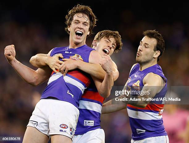 Liam Picken of the Bulldogs celebrates a goal with teammates during the 2016 AFL Second Semi Final match between the Hawthorn Hawks and the Western...