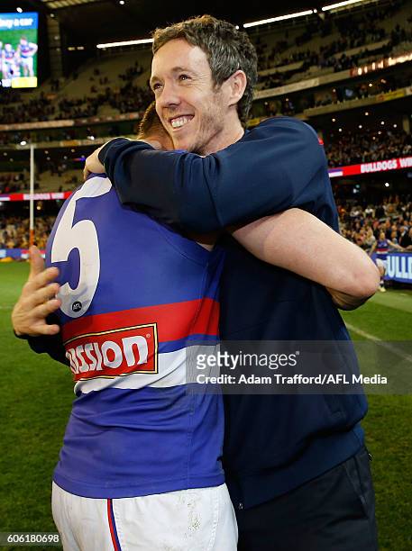 Robert Murphy of the Bulldogs hugs Matthew Boyd of the Bulldogs during the 2016 AFL Second Semi Final match between the Hawthorn Hawks and the...