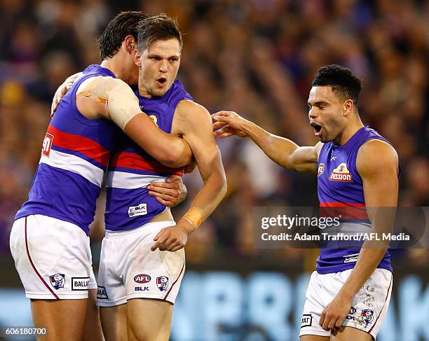 Clay Smith of the Bulldogs celebrates a goal with teammates during the 2016 AFL Second Semi Final match between the Hawthorn Hawks and the Western...