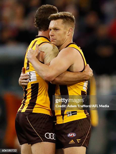 Sam Mitchell of the Hawks hugs Brendan Whitecross of the Hawks during the 2016 AFL Second Semi Final match between the Hawthorn Hawks and the Western...