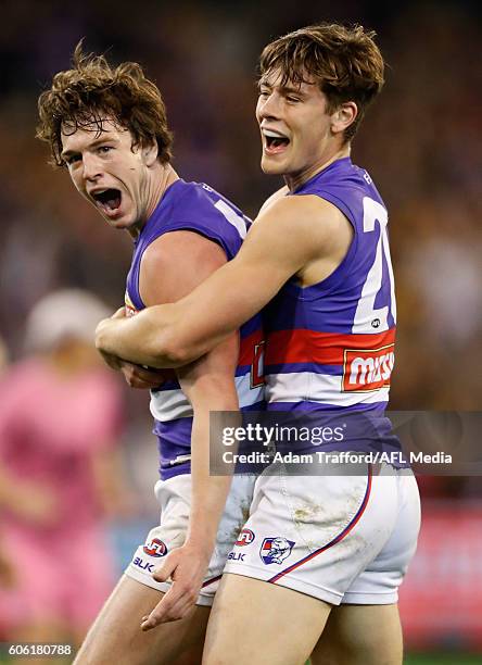 Liam Picken of the Bulldogs celebrates a goal with Josh Dunkley of the Bulldogs during the 2016 AFL Second Semi Final match between the Hawthorn...