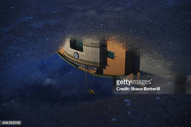 General view of the stadium reflected in a puddle prior to the Premier League match between Chelsea and Liverpool at Stamford Bridge on September 16,...