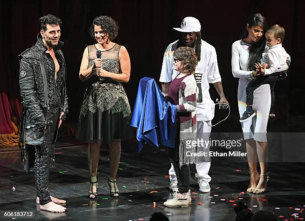 Illusionist Criss Angel, Make-A-Wish Southern Nevada President and CEO Caroline Ciocca, Kaila Elders from the Make-A-Wish Foundation, rapper Flavor...