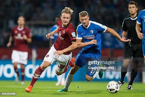 Cedric Teuchert of Nuernberg is challenged by Pawel Dawidowicz of Bochum during the Second Bundesliga match between VfL Bochum 1848 and 1. FC...