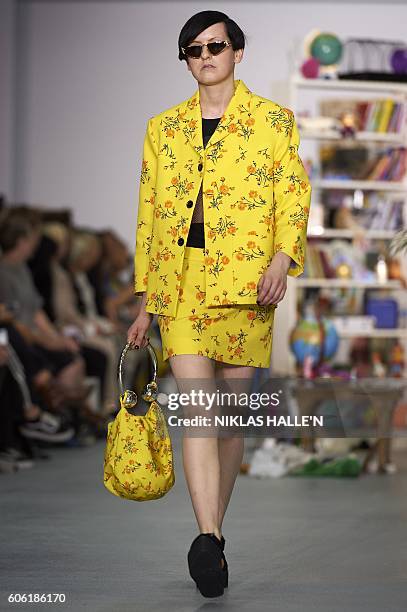 Model presents a creation by British designer Ashley Williams, during the 2017 Spring / Summer catwalk show during London Fashion Week in London on...