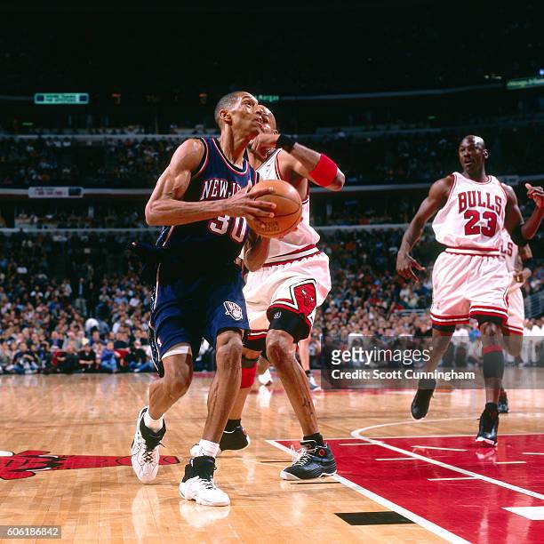 Kerry Kittles of the New Jersey Nets drives to the basket against the Chicago Bulls during Round One, Game One of the NBA Playoffs on April 24, 1998...