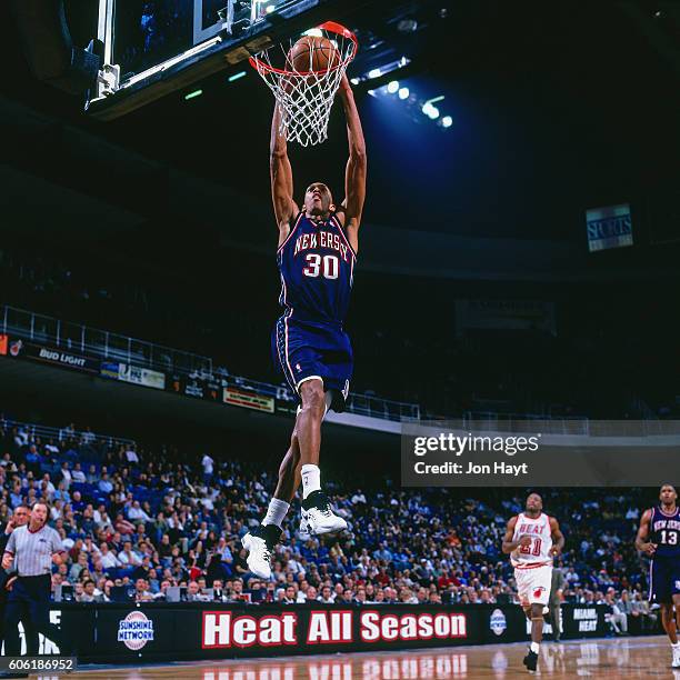 Kerry Kittles of the New Jersey Nets dunks the ball against the Miami Heat at Miami Arena in Miami, Florida on December 8, 1997. NOTE TO USER: User...