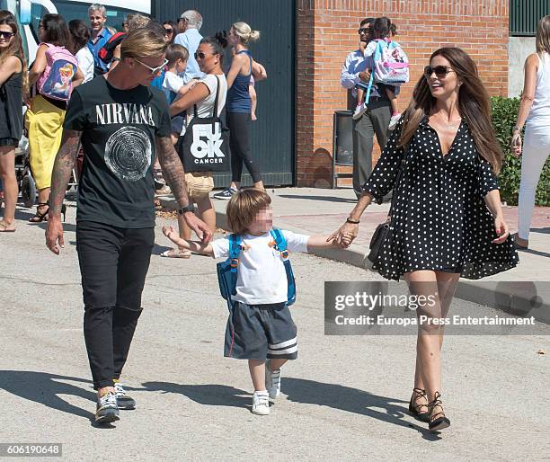 Part of this image has been pixellated to obscure the identity of the child). Ex Real Madrid football player Jose Maria Gutierrez Guti, his wife...