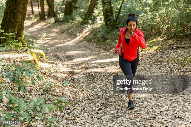 fit woman trail runner - indian woman muscles stock pictures, royalty-free photos & images