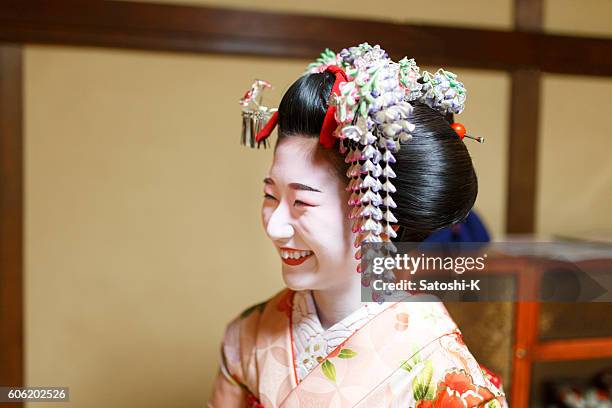 maiko girl toothy smiling in japanese tatami room - geisha in training stock pictures, royalty-free photos & images