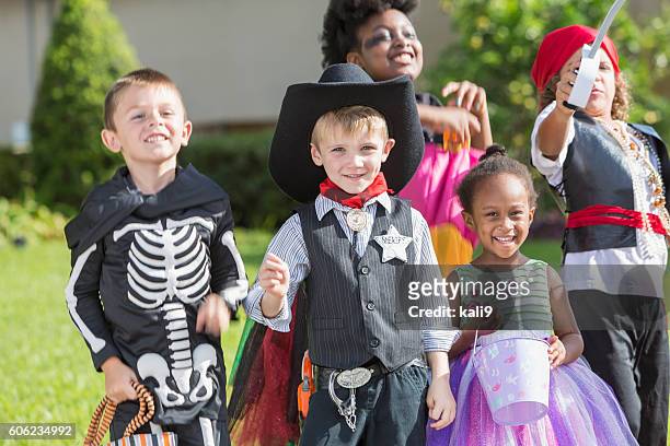 multi-ethnic group of children in halloween costumes - princess pirates stock pictures, royalty-free photos & images