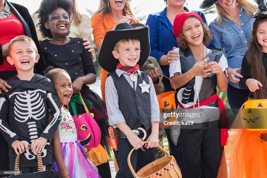 Group of women with children in halloween costumes