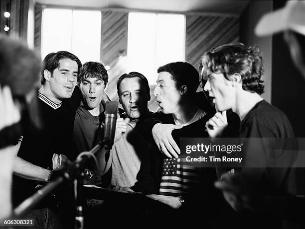 From left to right, English footballers Jamie Redknapp, Jason McAteer, unknown, Robbie Fowler and Steve McManaman of Liverpool FC, in a recording...