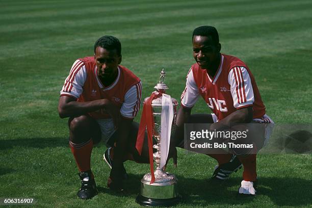 Arsenal players David Rocastle and Michael Thomas with the Littlewoods Cup after their team won the Football League Cup final, beating Liverpool 2-1...