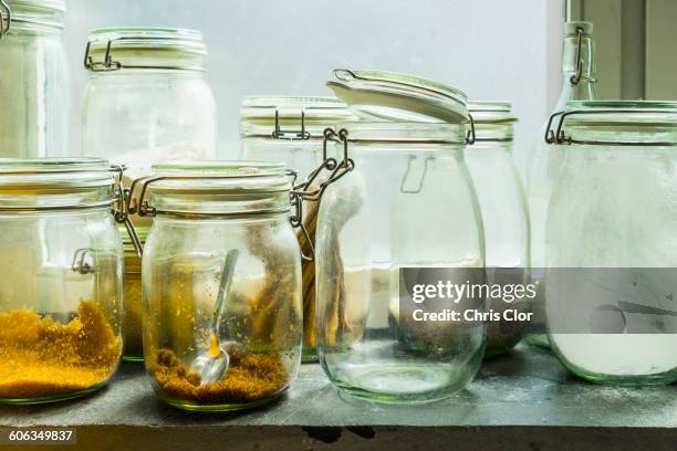 open jars in windowsill - mason jar stock pictures, royalty-free photos & images