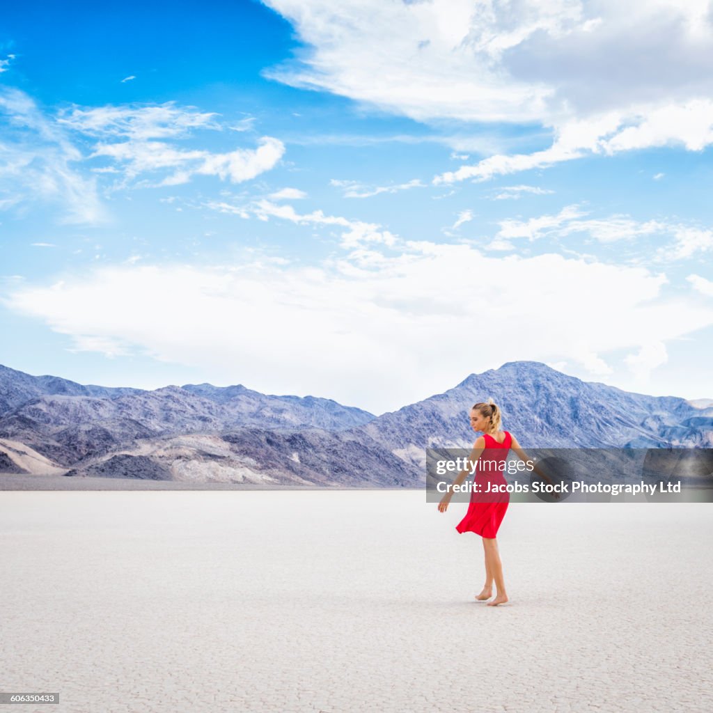 Hispanic woman standing in remote desert