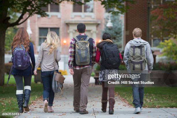college students walking on campus - campus ストックフォトと画像