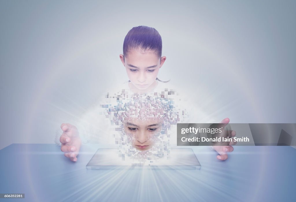 Mixed race girl with digital projection of face
