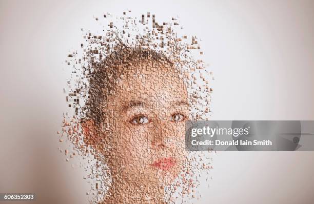 pixelated mixed race girl with serious expression - pixelated face stock-fotos und bilder